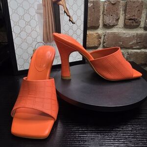 Gabrielle Union Orange Croc-Embossed Mules